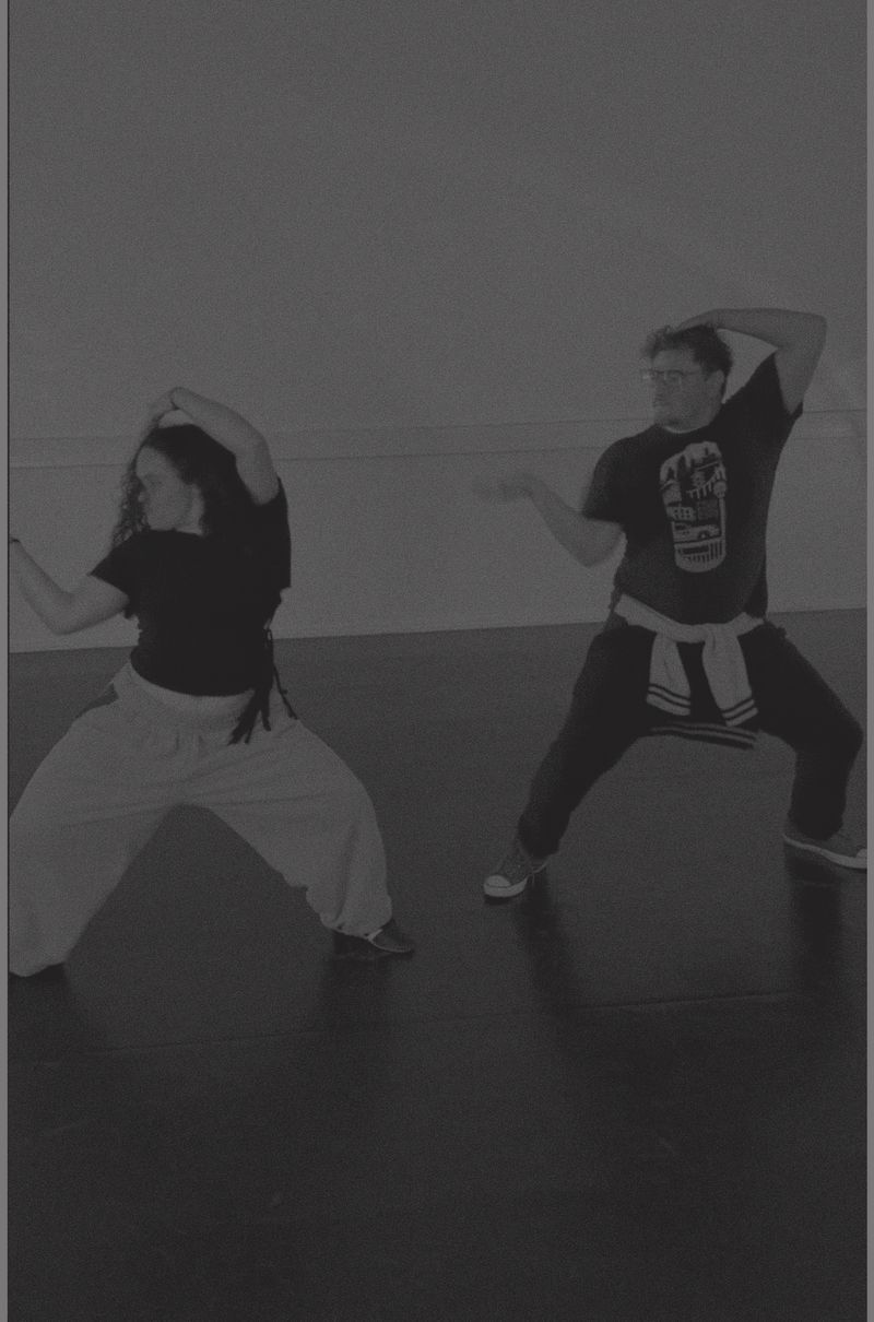 Two dancers hitting a pose together